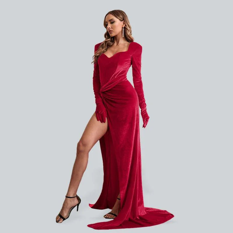 Woman wearing a red velvet long-sleeve evening dress with a high slit, fitted waist and floor-length hem. Perfect for weddings, special occasions, party, timeless luxury evening gown, elegant cocktail dresses for women ladies