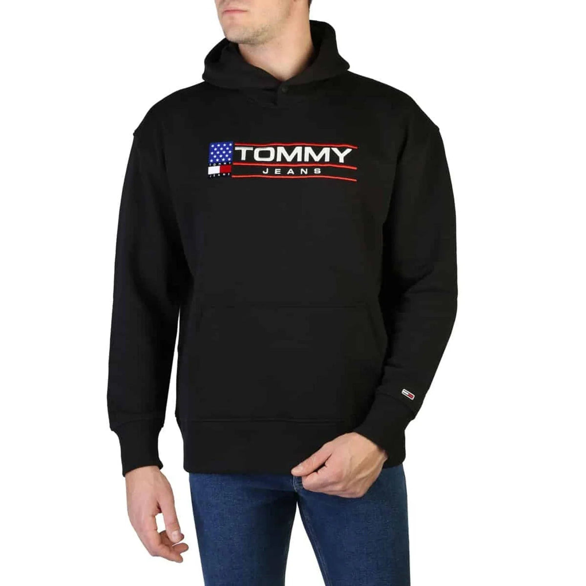 Man in a black pullover hoodie with a flag logo across the chest fashion image