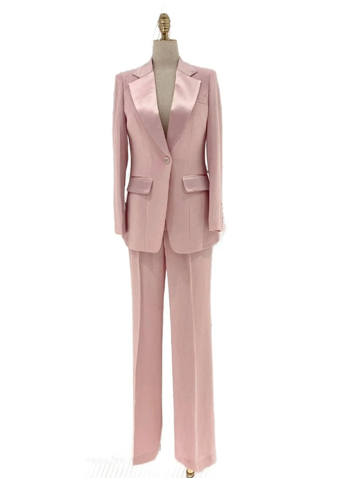 Pale pink single-button pantsuit with satin lapels and wide-leg trousers fashion image