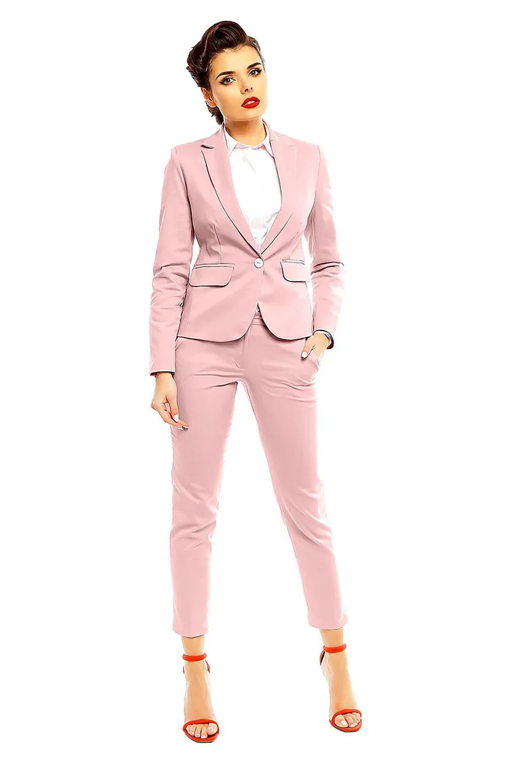 Woman in a pale pink blazer and matching cropped trousers with red sandals fashion image