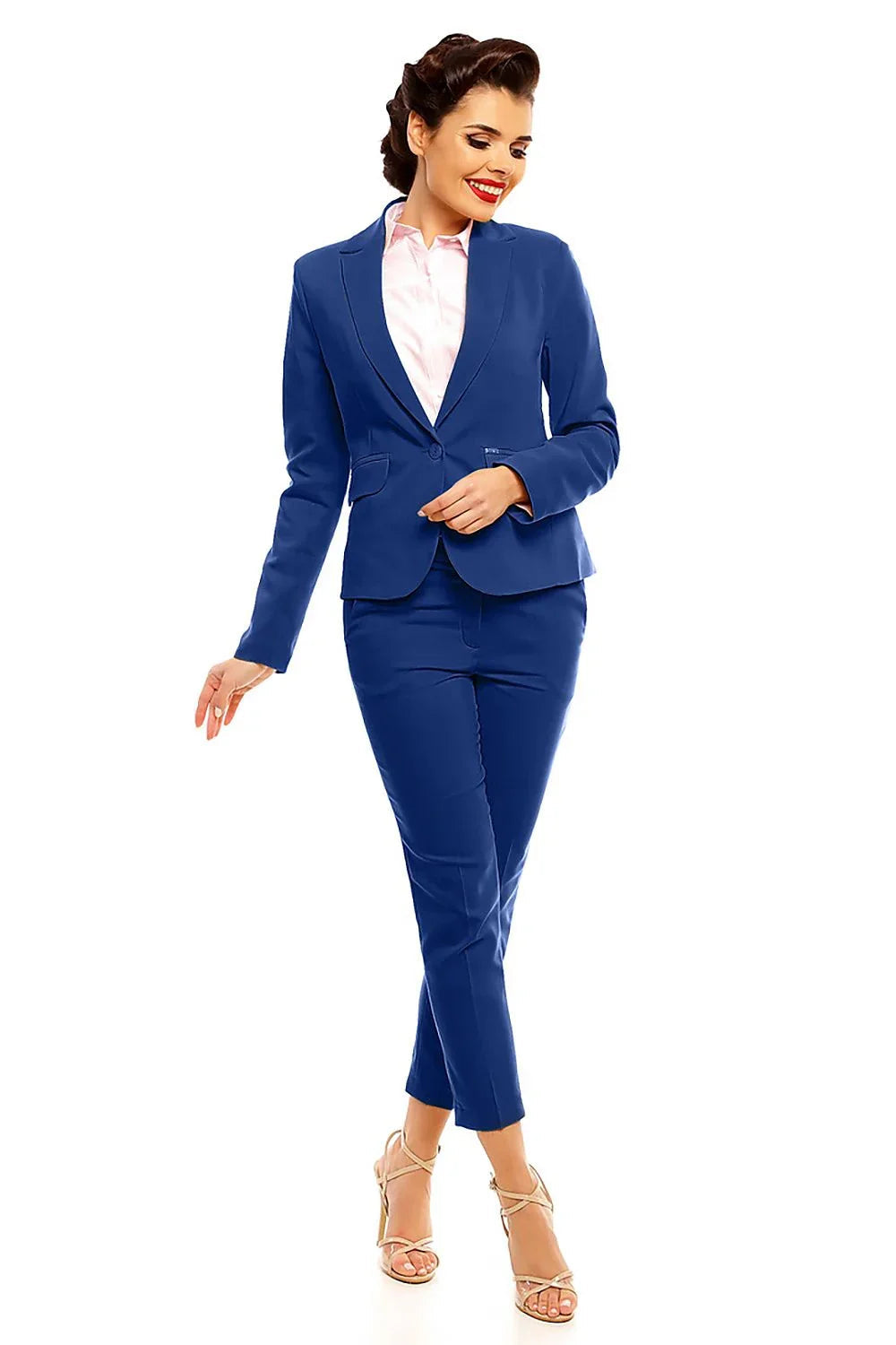 Woman in a royal blue blazer and matching cropped trousers with strappy heels fashion image