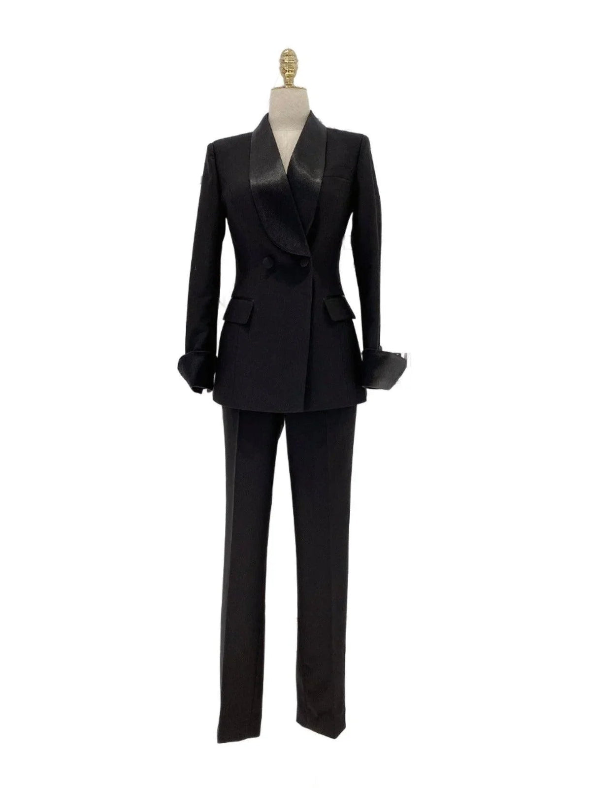 Black double-breasted tuxedo suit with a satin shawl lapel on a mannequin fashion image