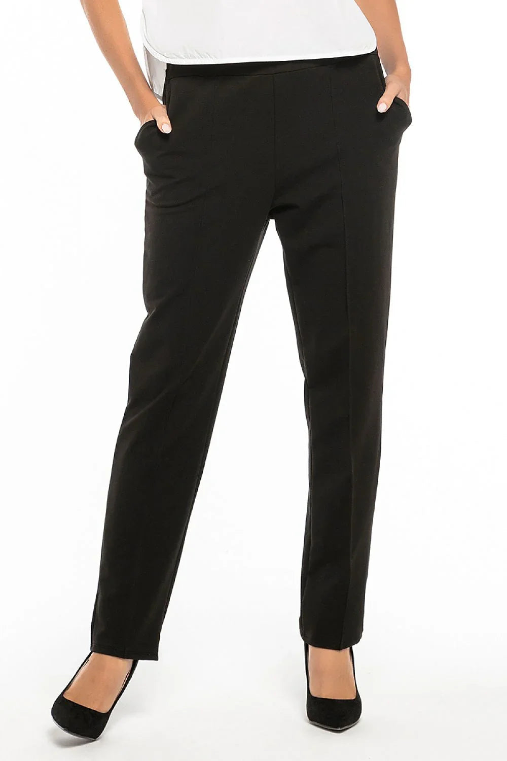 Black straight-leg trousers with front pleats and side pockets, worn with black heels fashion image