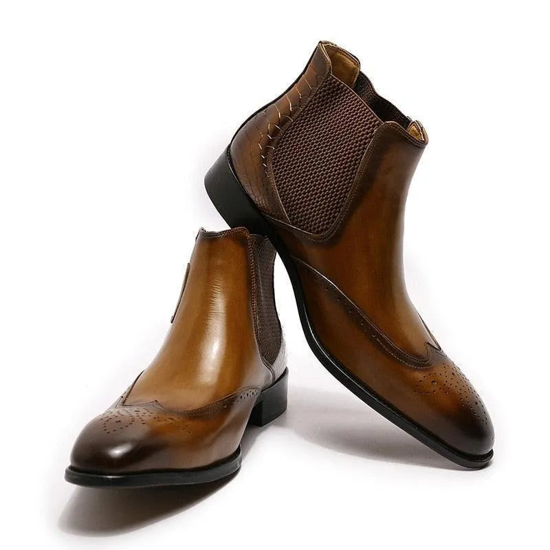 Brown leather slip-on ankle dress boots with brogue detailing and side elastic panels.