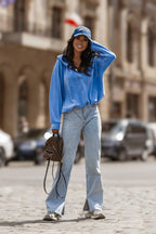 Women's hoodie blue logo detail view